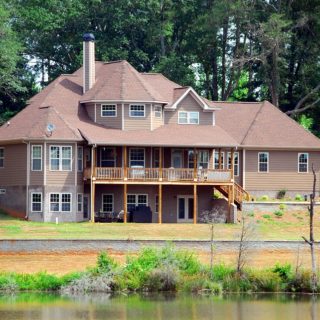 Brown house in middle of forest